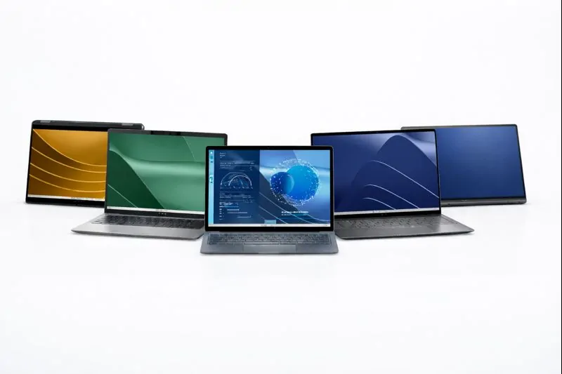 Multiple Dell Latitude series laptops displayed with various screen colors, showcasing sleek business-class design.